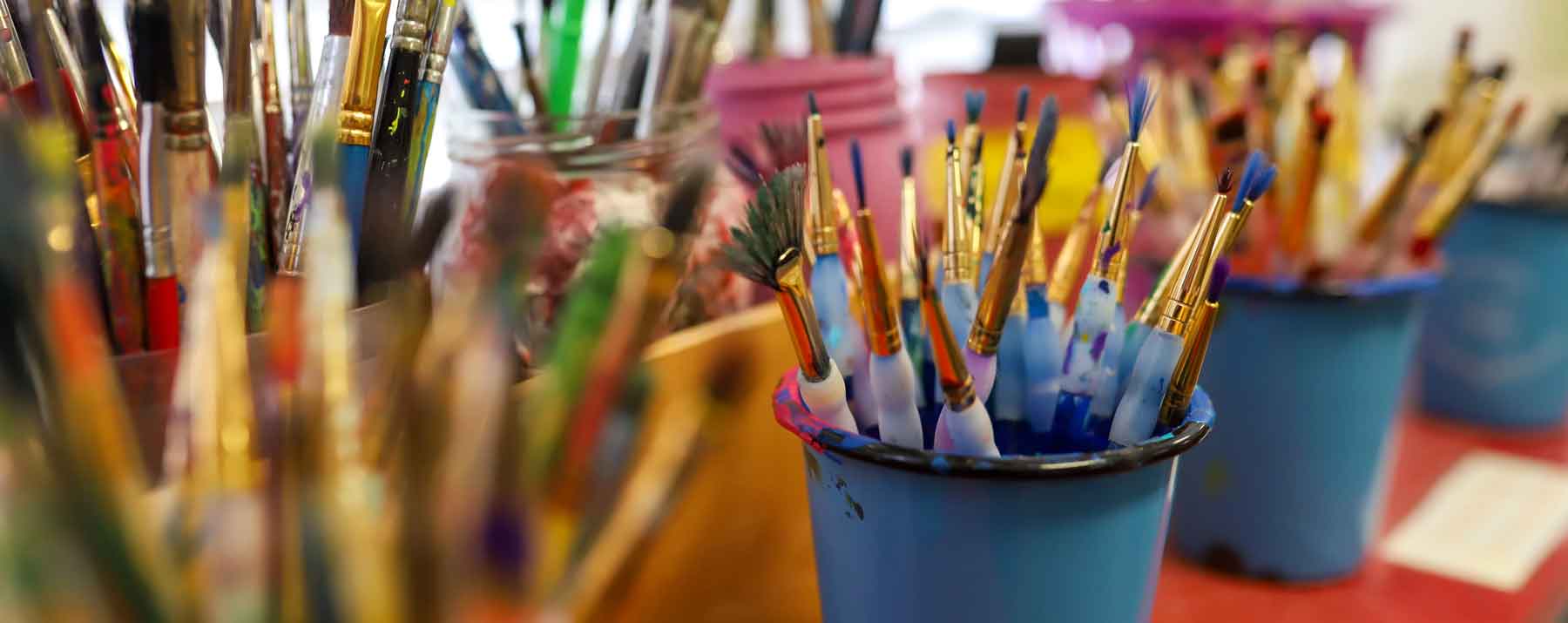 A generic picture of paint brushes and other art supplies.